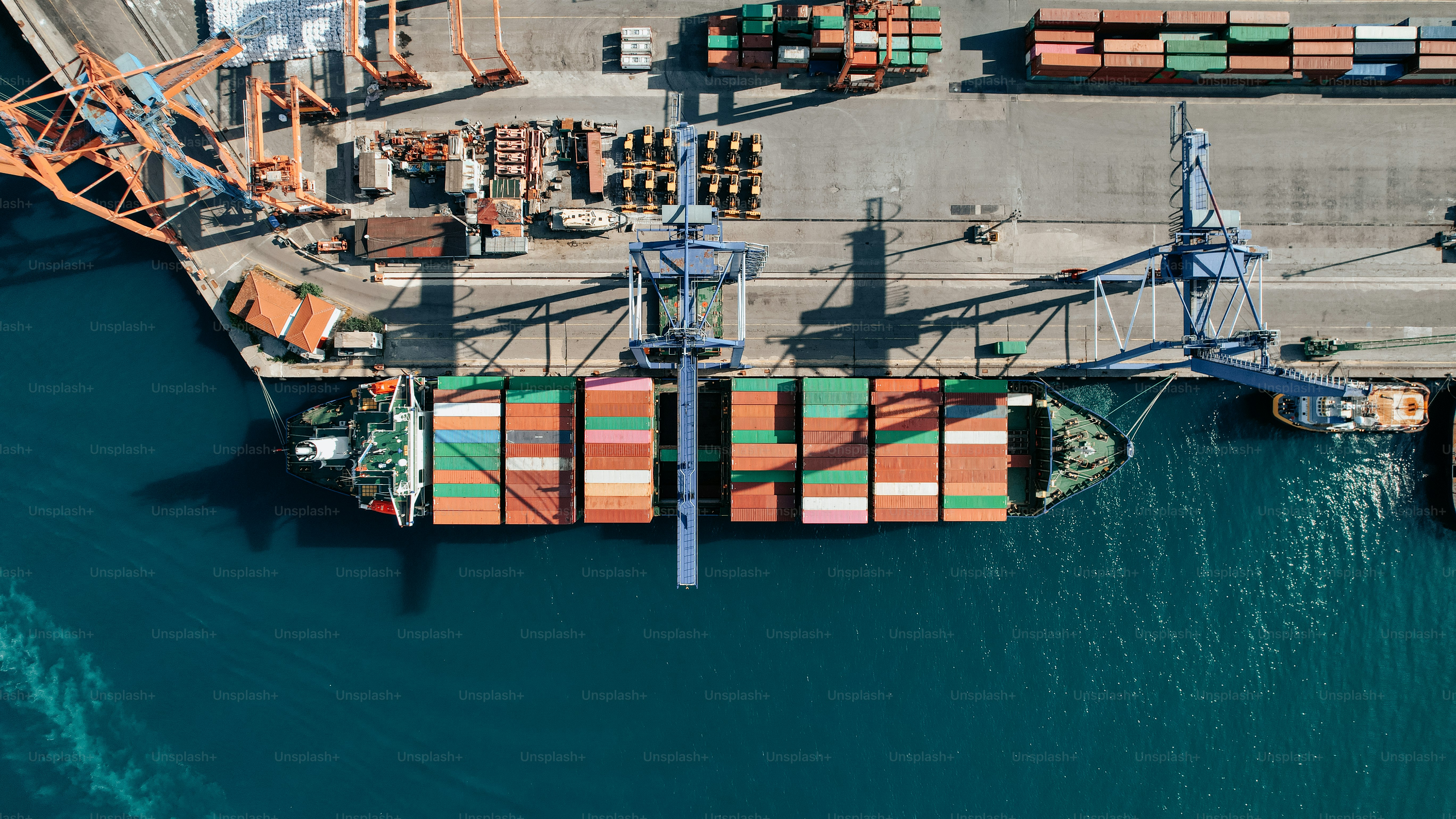 an aerial view of a cargo ship in the water
